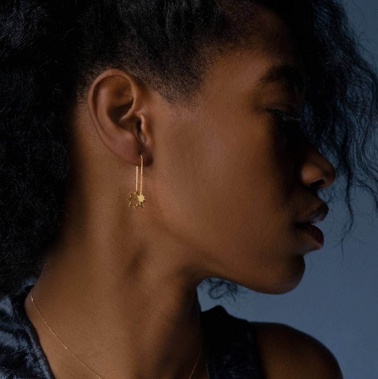Sweet Pea 18ct yellow gold Reach For The Stars front and back earring on model. Star and chain hanging earring on model.