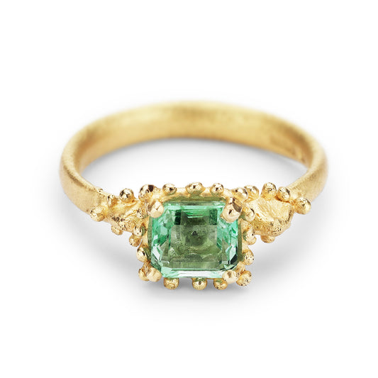 Ruth Tomlinson 18ct yellow gold ring with square facetted solitaire emerald with beaded granulation surround engagement ring. Alternative engagement ring. Organic emerald ring.  