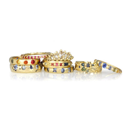 Stack of 18ct yellow gold Polly Wales rings. Polly Wales 18ct yellow gold Iris Halo Ring with round rose cut blue sapphires. Alternative engagement ring. Size M ring.